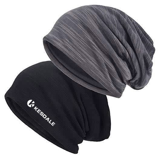 Two slouchy caps in black and grey, featuring a logo on the black cap. They are made from a breathable, stretchy fabric. Thin Breathable Stretch Slouchy Cap - Image 1