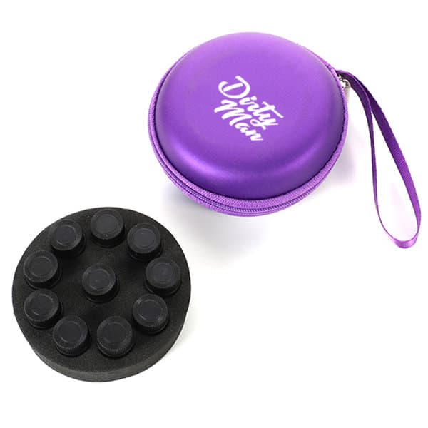 A round purple carrying case with a zip and a wrist strap, containing a black circular essential oil holder. Round Essential Oil Carrying Case - Image 1