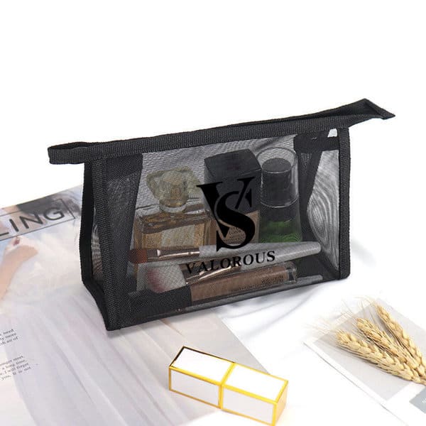 A black mesh makeup bag contains various cosmetic items and has a logo on the front. Mesh Makeup Bag - Image 1