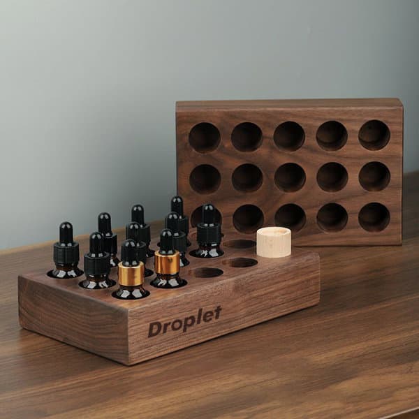 A wooden essential oil tray featuring multiple holes to hold bottles, in a rich walnut finish. Wooden Essential Oil Tray - Image 1