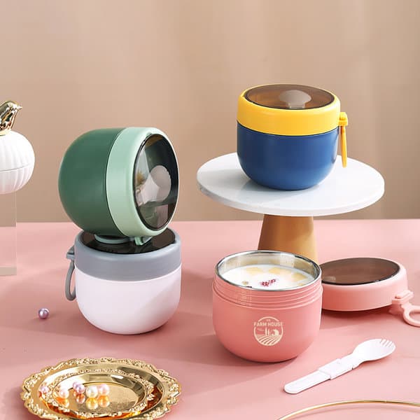 A set of four stainless steel insulated breakfast cups in green, blue, pink, and white, featuring various lids and a logo. Stainless Steel Insulated Breakfast Cup - Image 1