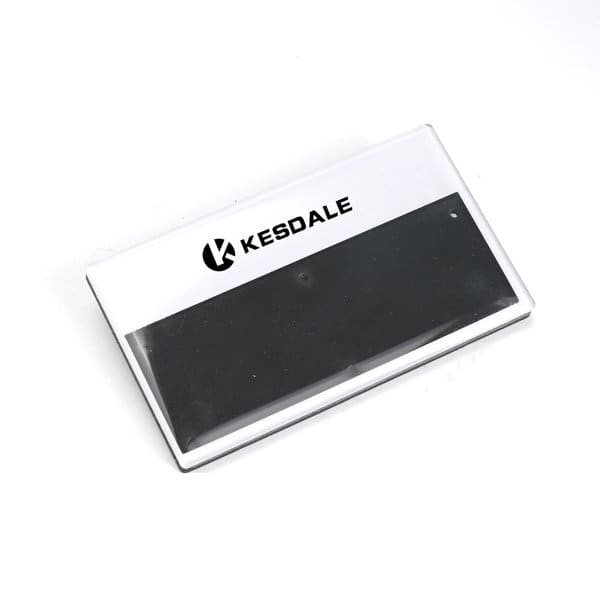 Acrylic name badge with a black magnetic area and a logo on the front, featuring a clear background. Acrylic Name Badge With Pin - Image 1