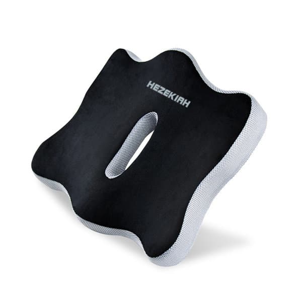 A black memory foam car seat pad with a cut-out section and a textured edge. Features a logo on the surface. Memory Foam Car Seat Pad - Image 1