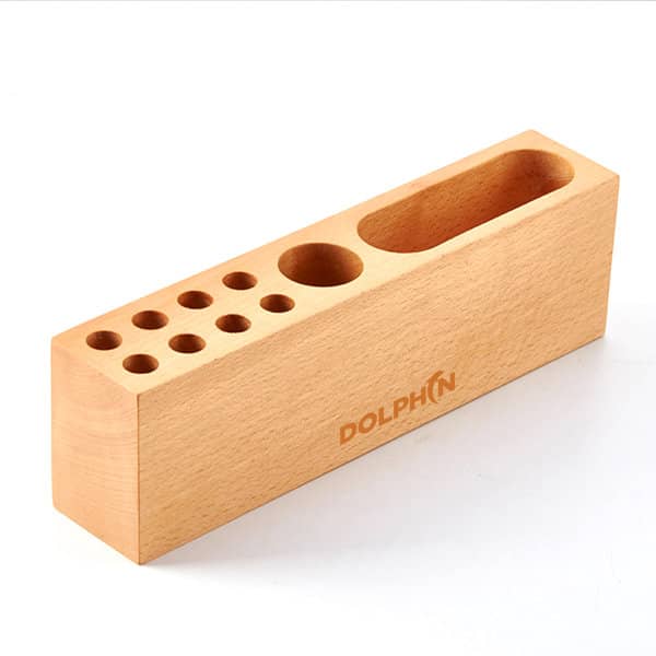 A wooden pen holder in natural finish with multiple holes for pens and a slot for larger items. It has a logo. Multifunctional Wooden Pen Holder - Image 1
