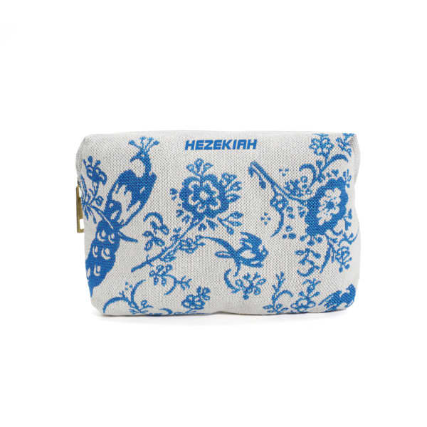 A custom jacquard embroidery bag featuring a floral design in blue on a light grey background. It has a logo on the front. Custom Jacquard Embroidery Bag - Image 1