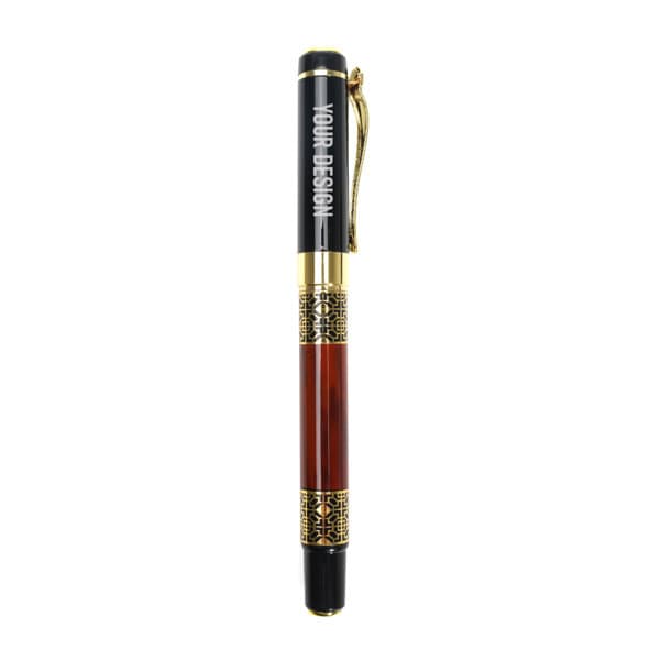 A vintage fountain pen with a black and brown barrel, gold accents, and a decorative band. It features a logo. Vintage Fountain Pen - Image 1