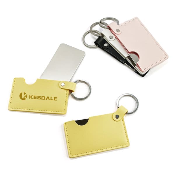 A rotating credit card mirror with a PU leather holder, available in yellow, pink, and black, featuring a logo. Rotating Credit Card Mirror With PU Leather Holder - Image 1