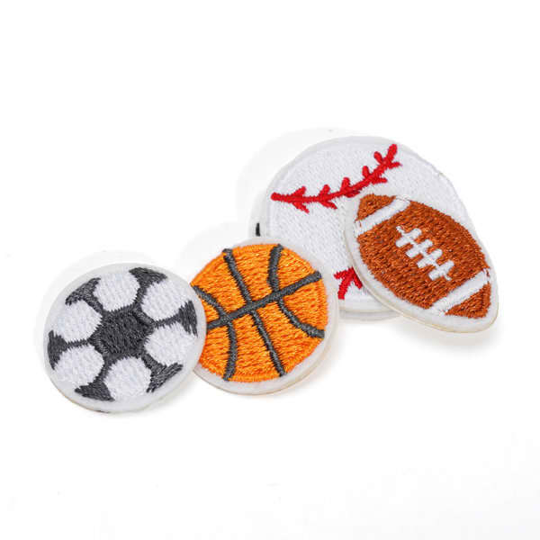 Four self-adhesive cloth embroidery patches featuring a soccer ball, basketball, baseball, and American football, primarily in white, orange, and black. Self Adhesive Cloth Embroidery Patches - Image 1