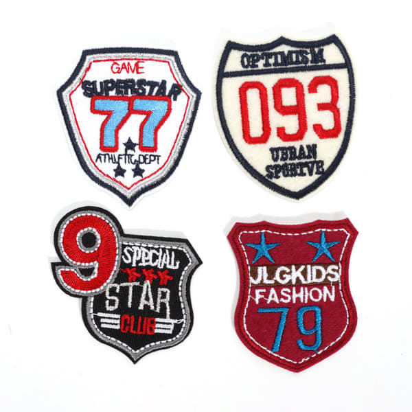 Four custom embroidered patches in red, white, and blue featuring various designs and text. Custom Embroidery Patch - Image 1