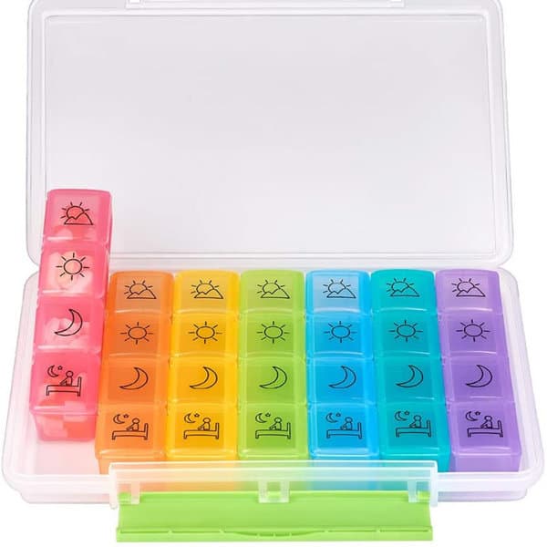 A rainbow-coloured seven-day pill box with sections for each day, featuring sun and moon icons. It has a transparent case. Rainbow 7 Days Pill Box - Image 1