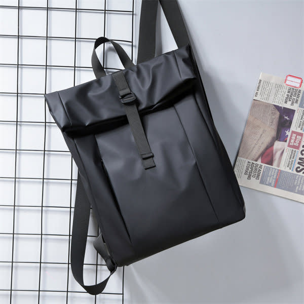 A black expandable casual laptop daypack with adjustable straps and a flap opening, featuring a logo. Expandable Casual Laptop Daypack - Image 1