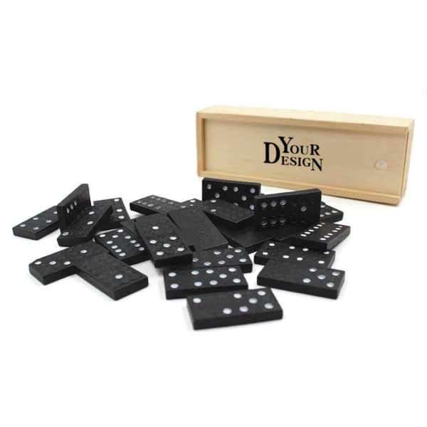 A custom dominoes set featuring black dominoes with white dots, presented in a wooden box with branding. Custom Dominoes Set - Image 1