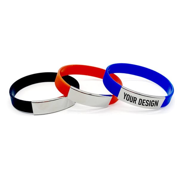 Three silicone wristbands in black, orange, and blue, each featuring a metallic panel and a logo. Metal Silicone Wristbands - Image 1