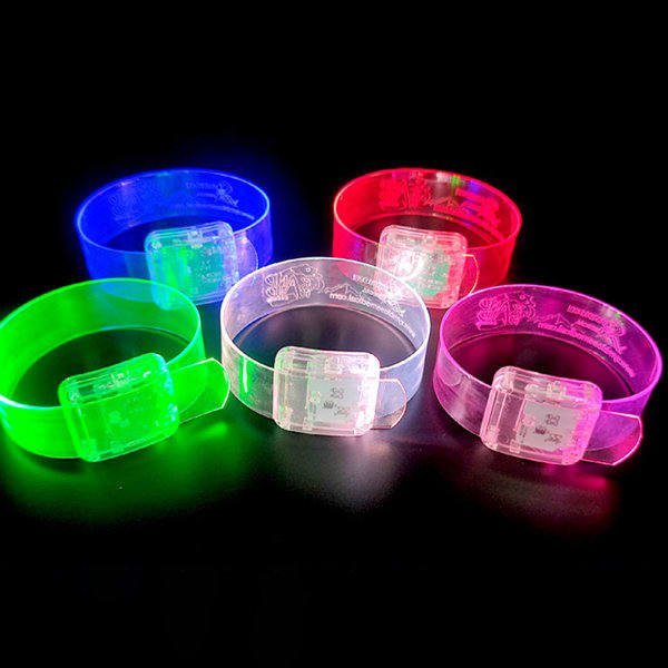 Five custom clear LED wristbands in blue, red, green, pink, and clear, each with a light-up feature and a logo. Custom Clear LED Wristband - Image 1