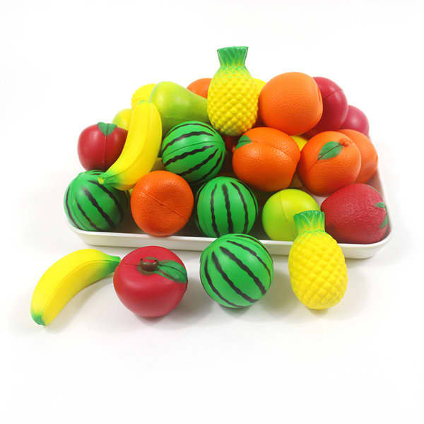 A collection of brightly coloured stress balls shaped like various fruits, including pineapples, watermelons, and bananas. Custom PU Stress Ball Keychain - Image 1