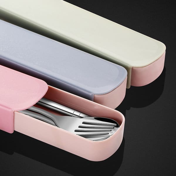 A portable stainless steel cutlery set in a pastel pink, grey, and green case, with a logo on the packaging. Portable Stainless Steel Cutlery Set - Image 1