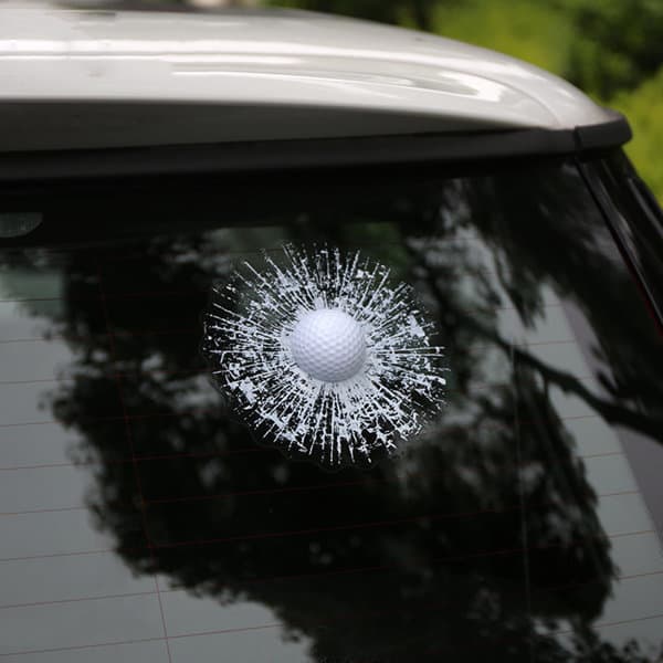 A golf ball car window sticker featuring a white golf ball with burst effects, placed on a vehicle's rear window. 3D Simulation Golf Ball Car Window Sticker - Image 1