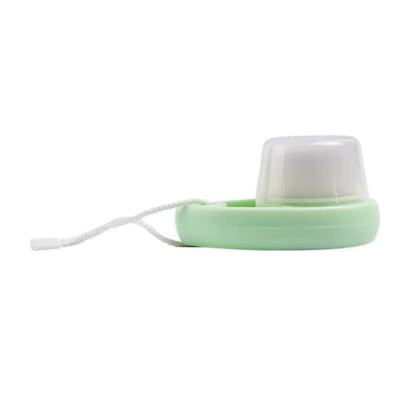 A soft bristle face cleansing brush in mint green with a white bristle head and a string for hanging. Soft Bristle Face Cleansing Brush - Image 1