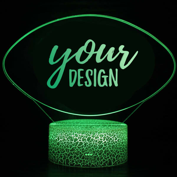 A 3D illusion LED night light featuring a clear design on a textured green base. 3D Illusion LED Night Light - Image 1