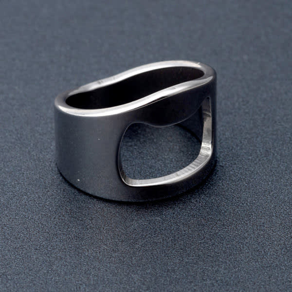 A drink bottle opener ring made of titanium steel, featuring a sleek, dark metallic finish and a unique design. Titanium Steel Beer Bottle Opener Ring - Image 1