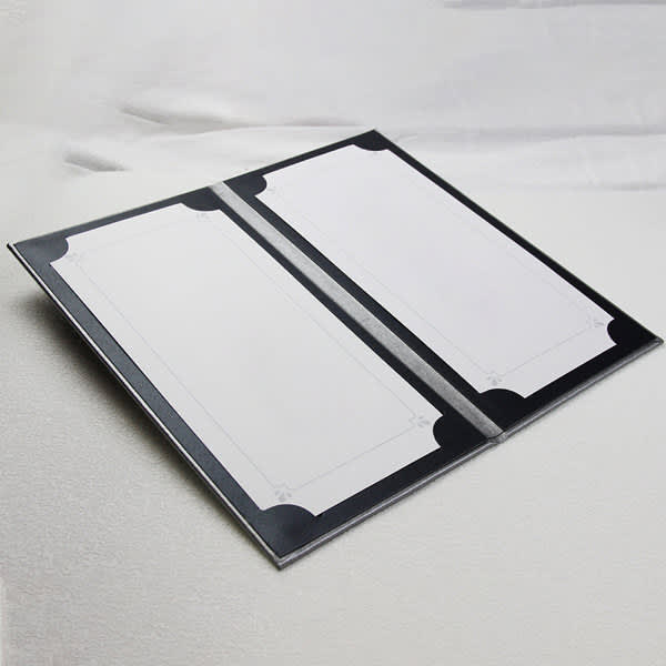 A black PU leather menu cover with blank white inserts, featuring decorative corners. It has a sleek, elegant design. PU Leather Menu Covers - Image 1