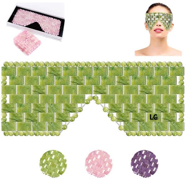 A jade eye mask in green, with small textured embellishments, displayed alongside a pink version and a model wearing the mask. Natural Jade Eye Mask - Image 1
