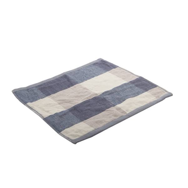 A checked cotton hand towel featuring a mix of navy blue and cream squares with a grey border. Checked Cotton Hand Towel - Image 1