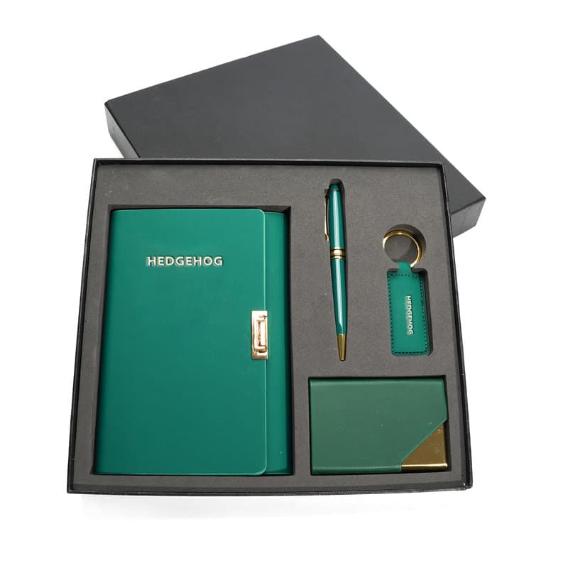 A green A6 PU spiral notebook set featuring a pen, keyring, and cardholder, presented in a black gift box. A6 PU Spiral Notebook Gift Set - Image 1