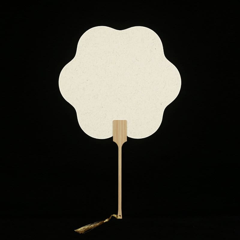 A custom bamboo hand fan in a flower shape, featuring a wooden handle and a decorative tassel, with a cream colour. Custom Bamboo Hand Fan - Image 1