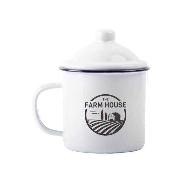 A white enamel mug with a lid, featuring a logo on the front and a sturdy handle. 6 oz. Enamel Mug With Lid - Image 1