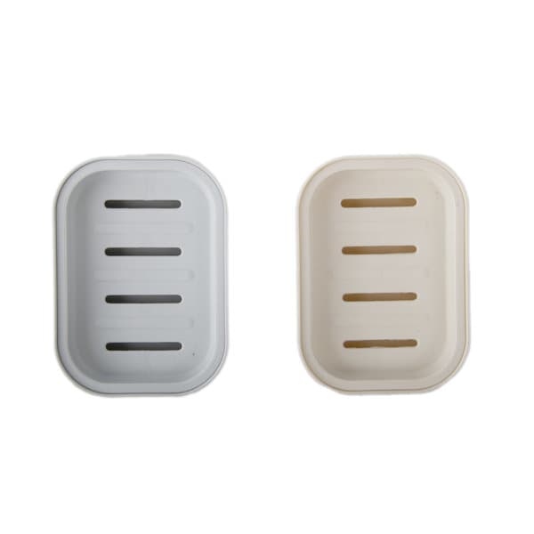 A double-layer soap holder in grey and cream, featuring drainage slits for water removal. Includes branding on the surface. Double Layer Soap Holder With Water Drain - Image 1