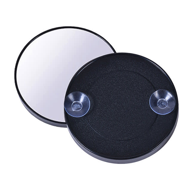 A magnifying mirror with a suction cup, featuring a sleek black design and a reflective glass surface. Magnifying Mirror With Suction Cup - Image 1