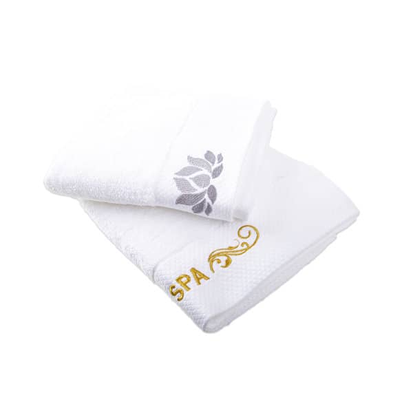 A set of two white embroidered cotton towels, featuring a floral design and the word "SPA" in gold. Embroidered Premium Thickened Cotton Towel - Image 1