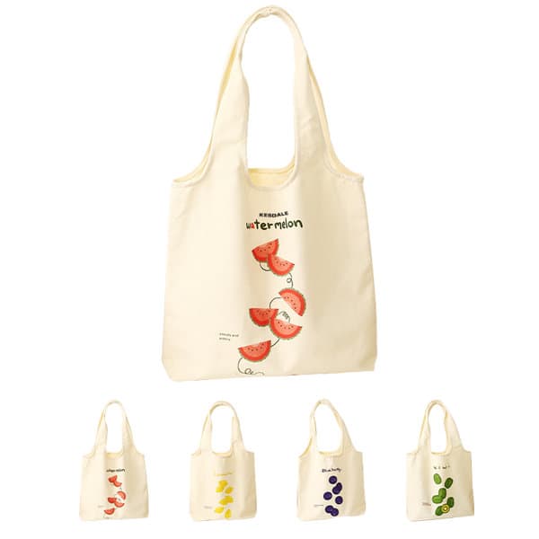 A cream reusable canvas grocery bag with fruit illustrations, featuring a logo and four smaller bags in various colours. Reusable Canvas Grocery Bag - Image 1