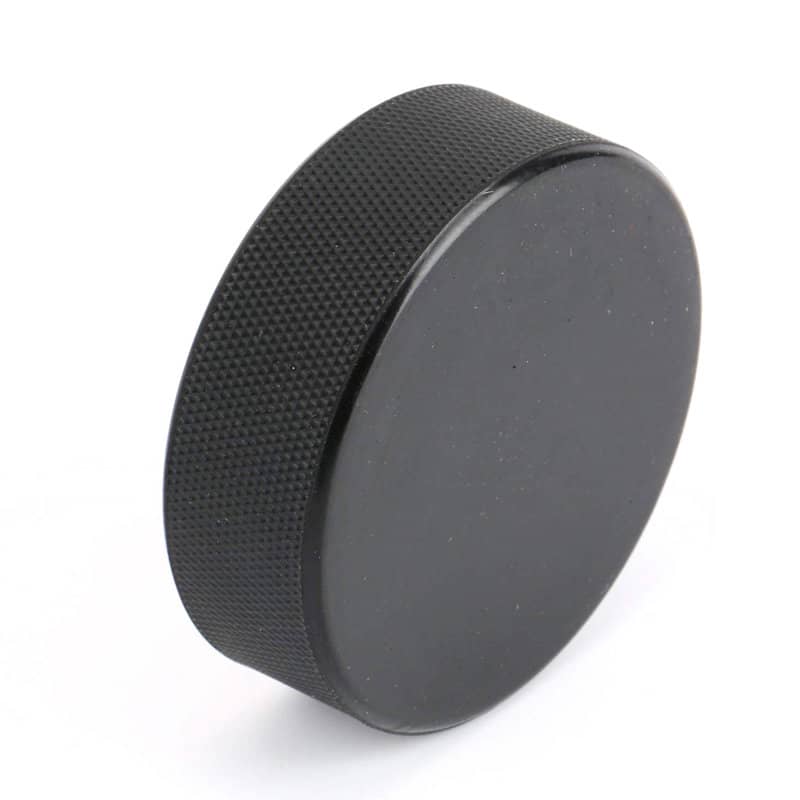 A black rubber ice hockey puck with a textured surface, featuring a logo. Custom Rubber Ice Hockey Puck - Image 1