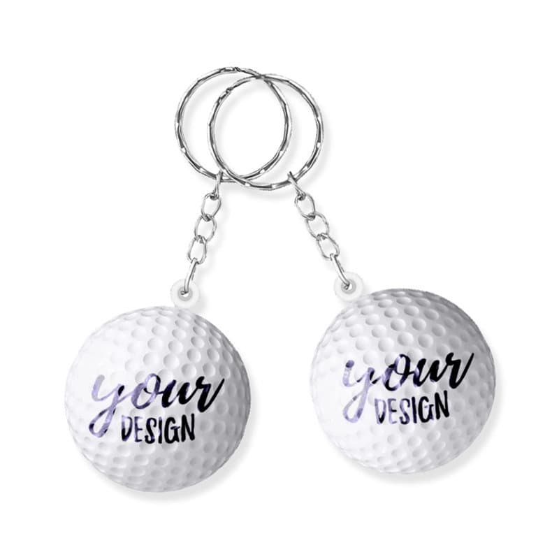 A white golf ball stress reliever key chain with two key rings attached. It features a design placeholder. Golf Ball Stress Reliever Key Chain - Image 1