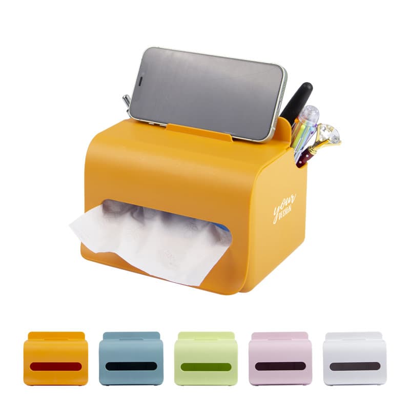An orange multifunctional tissue box with a slot for a phone and compartments for pens, alongside four additional colour options. Multifunctional Tissue Box - Image 1