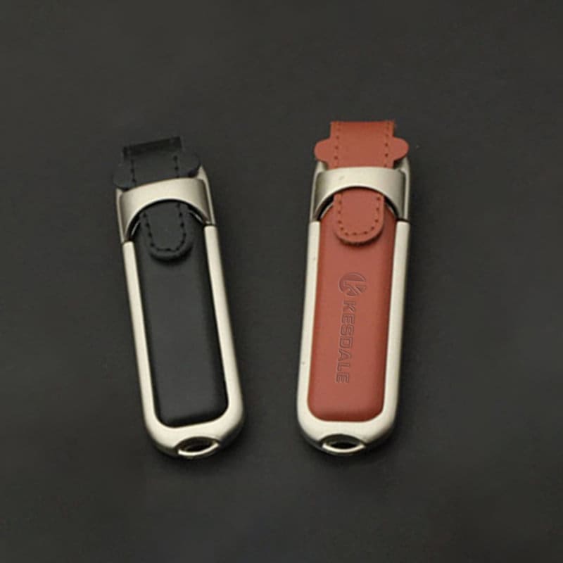 A leather USB flash drive in black and brown, featuring a sleek metallic casing and a logo. 4G Leather USB Flash Drive - Image 1