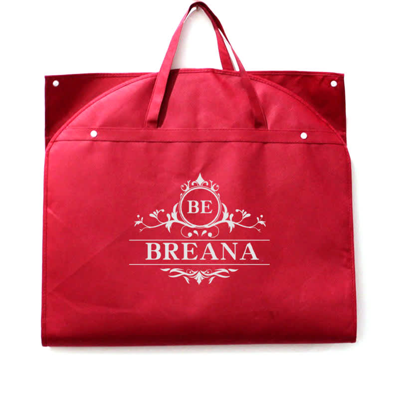 A red garment bag with handles and a decorative logo. Features snap closures for secure storage. Dust Cover Hanging Garment Bag - Image 1