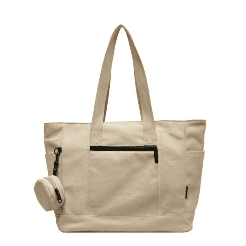 A large capacity canvas shoulder bag in cream, featuring multiple pockets and a detachable zippered pouch, with a logo. Large Capacity Canvas Shoulder Bag - Image 1