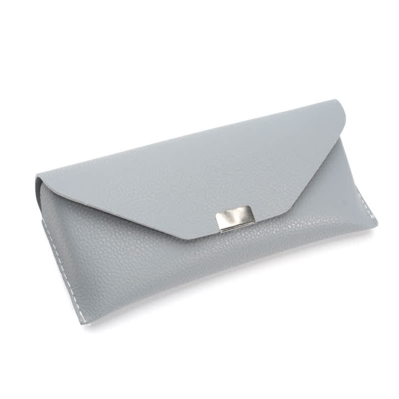 A grey glasses case with a sleek design, featuring a textured exterior and a metallic clasp. Lychee Pattern Glasses Case - Image 1