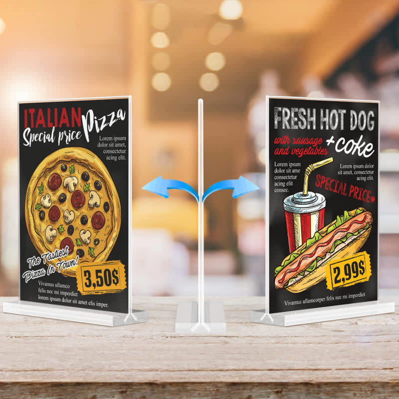 Two clear acrylic sign holders, displaying colourful promotional signs for pizza and hot dogs. The holders are white. Clear Acrylic Sign Holder - Image 1