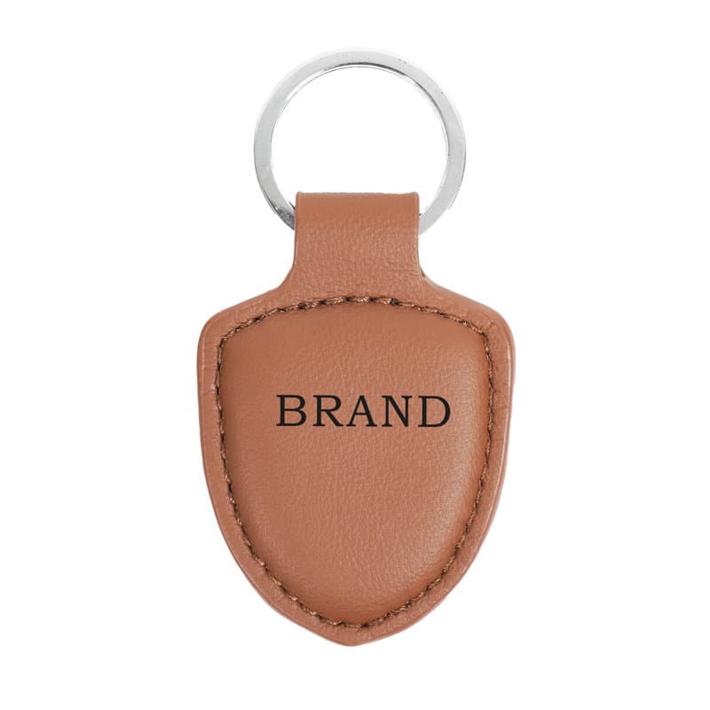 A personalised leather keychain in tan colour with a silver ring and a logo on the leather surface. Personalized Leather Keychain - Image 1