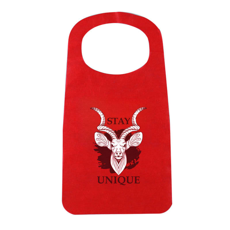 A red disposable non-woven apron with a graphic design featuring a goat's head and text. Disposable Non Woven Apron - Image 1