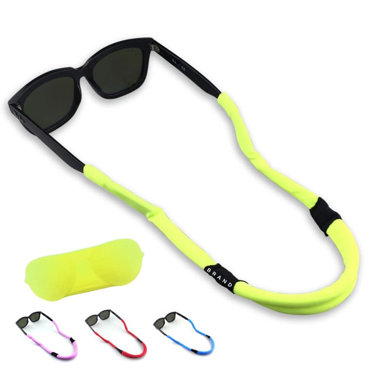 A neon yellow eyeglass string holder with black sunglasses, alongside various coloured straps. Includes a soft carrying pouch. Eyeglass String Holder - Image 1