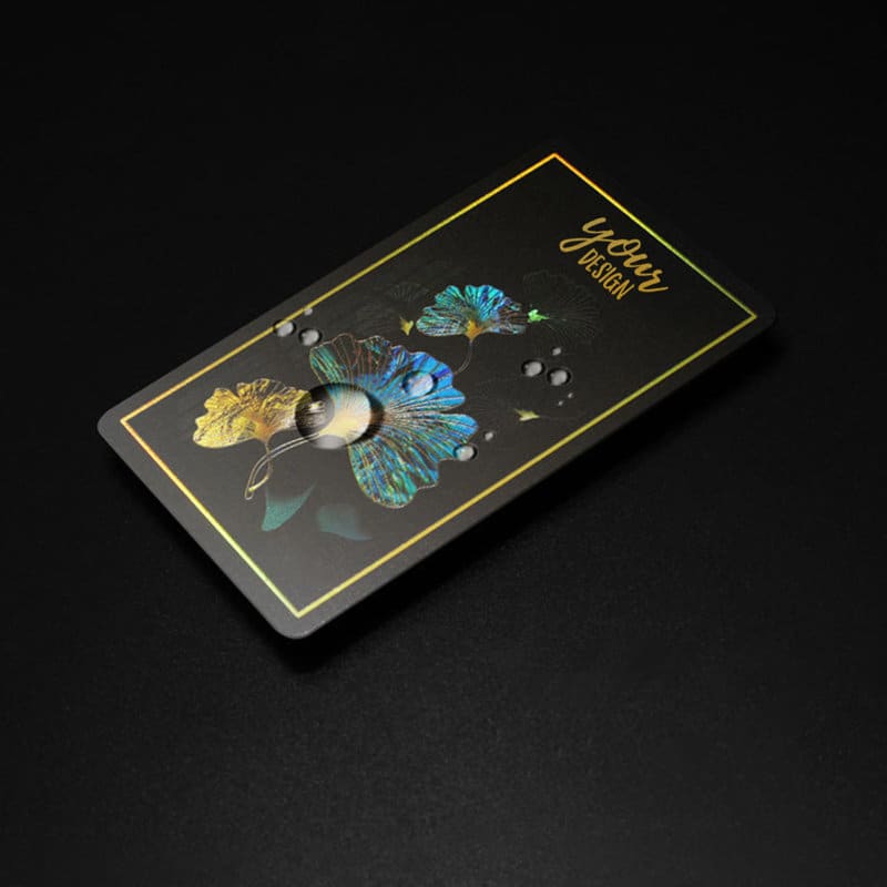 A vibrant holographic rainbow business card featuring floral designs on a black background, with a gold border. Personalized Holographic Rainbow Business Cards - Image 1