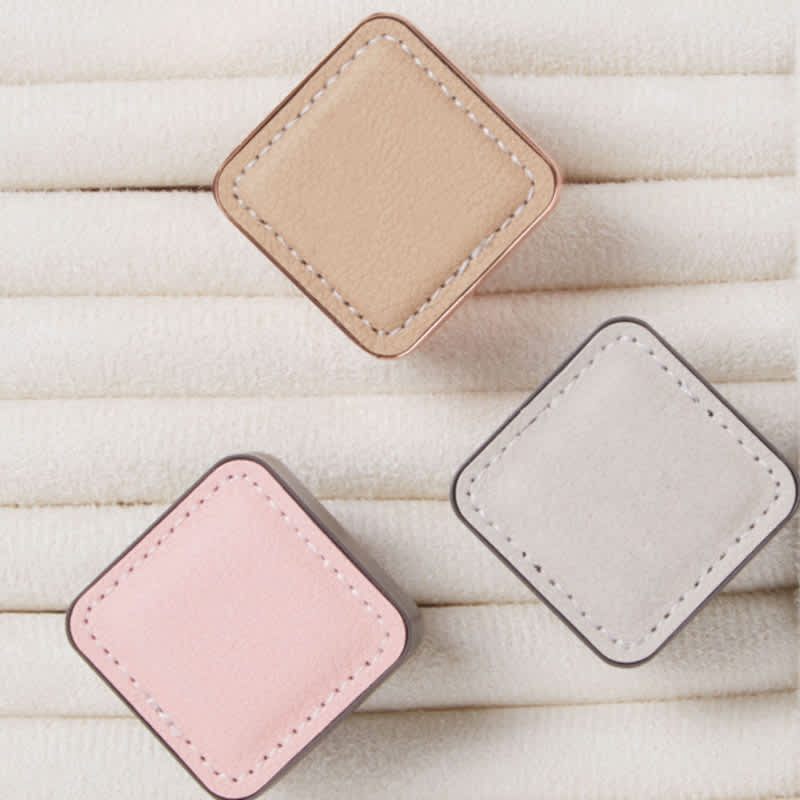 Three square air freshener clips in beige, pink, and grey, displayed on a textured white background. Car Air Freshener Ventilation Clip - Image 1
