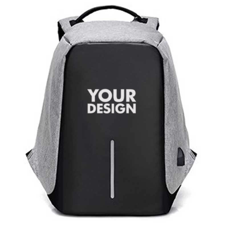 A grey and black travel backpack featuring a USB charging port and a logo area on the front. Travel Backpack With Usb Charging Port - Image 1