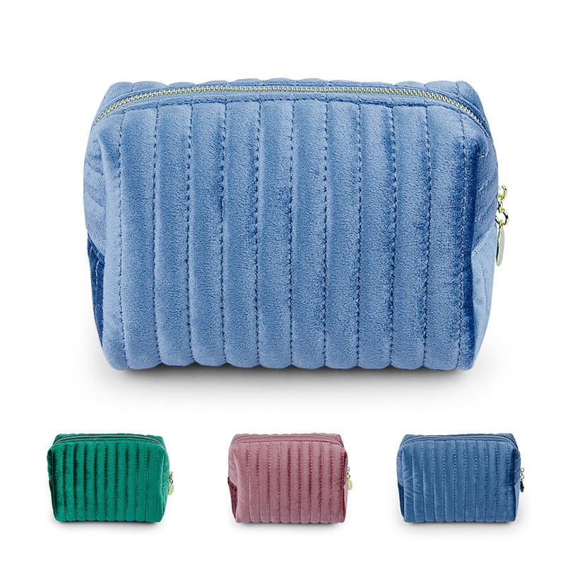 A plush, quilted makeup bag in light blue with a zipper, featuring options in green, pink, and darker blue below. Personalized Makeup Bag - Image 1
