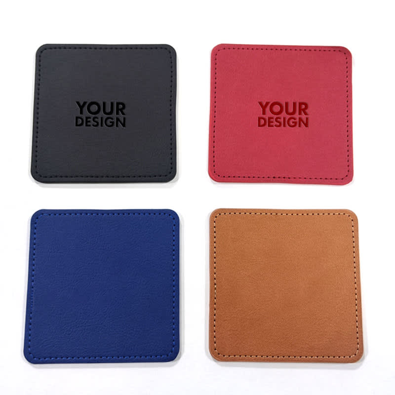 Four PU leather coasters in black, red, blue, and brown featuring a branding logo. 4 Packs PU Leather Coasters - Image 1